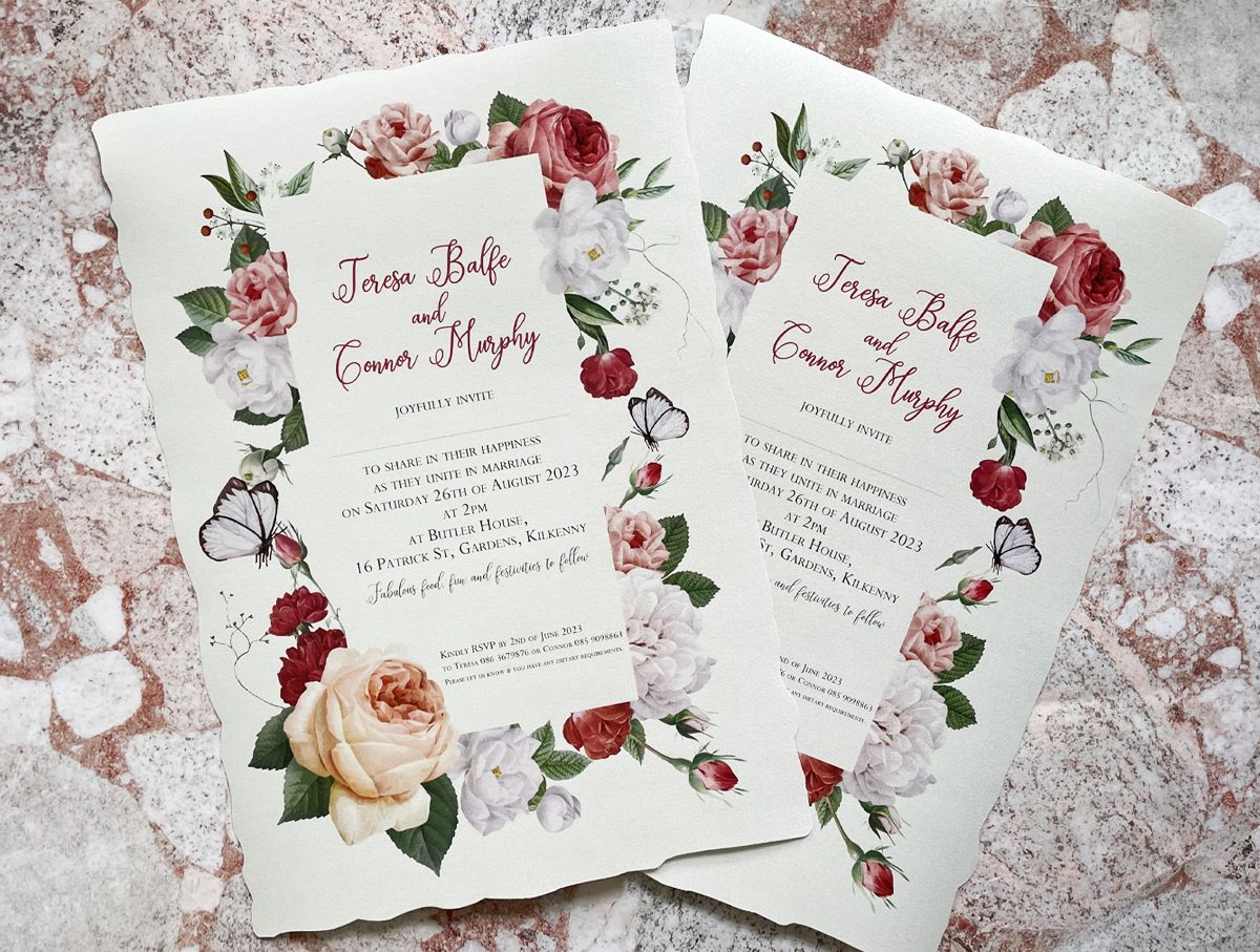 floral box and scroll wedding invitation