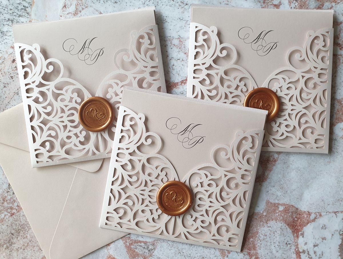 blush pink wedding invitation with rose gold wax seal