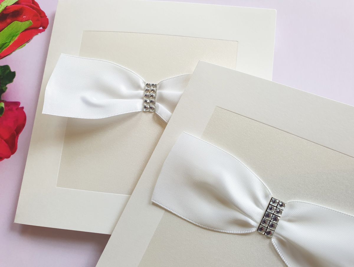 white shimmer wedding invitation