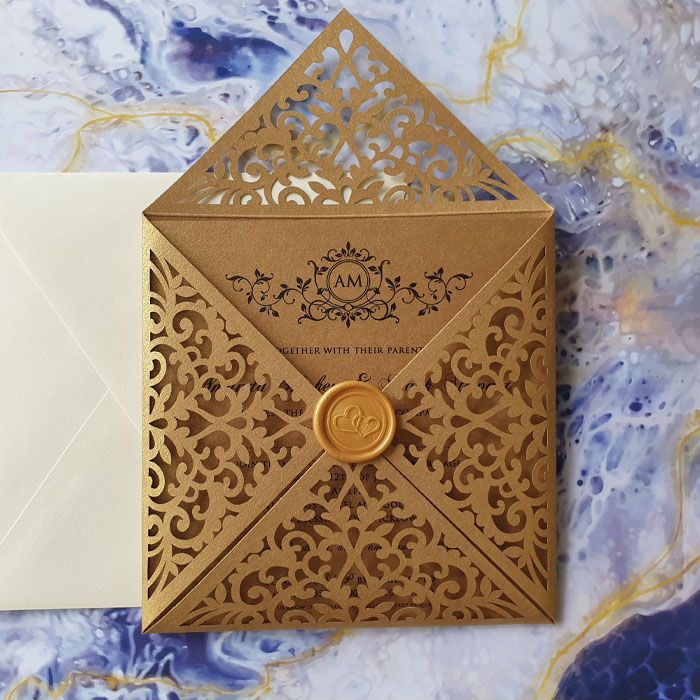 beautiful modern gold wedding invitation with wax seal